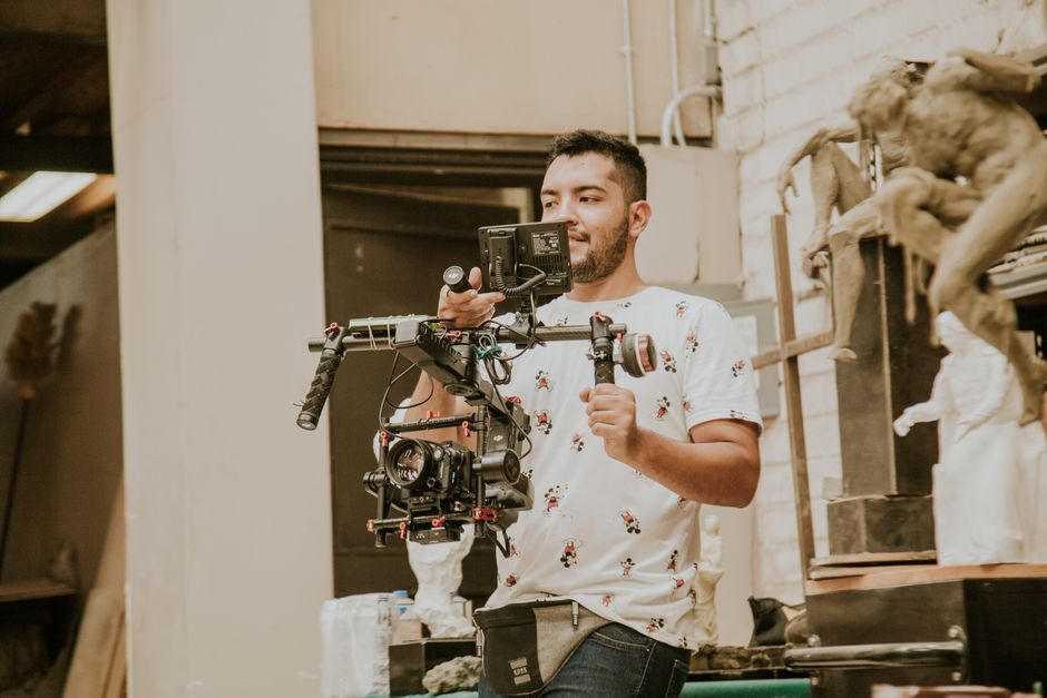 Wedding videographer filming a cinematic moment